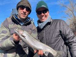 Happy angler with trout